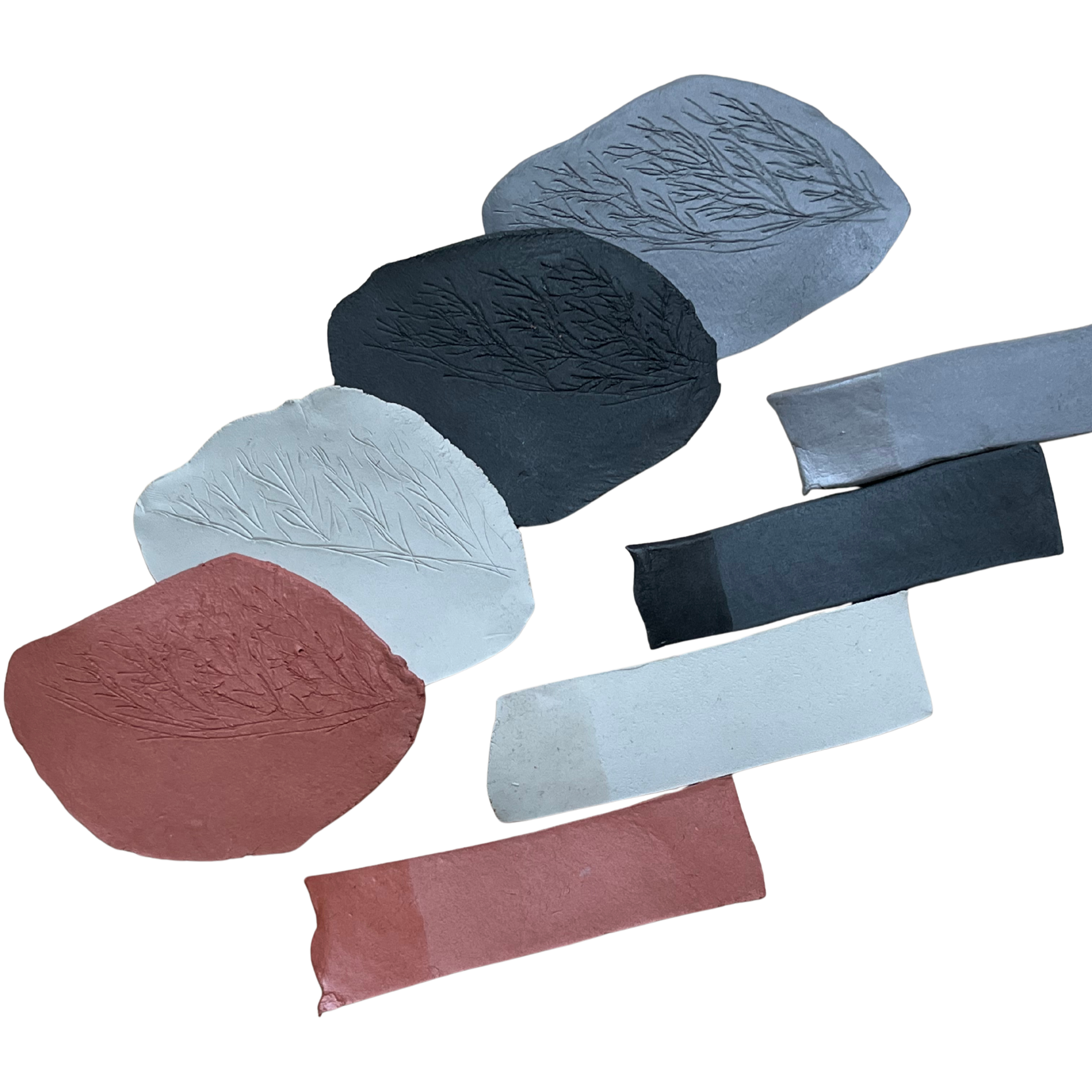 Collection of textured clay pieces in various colours